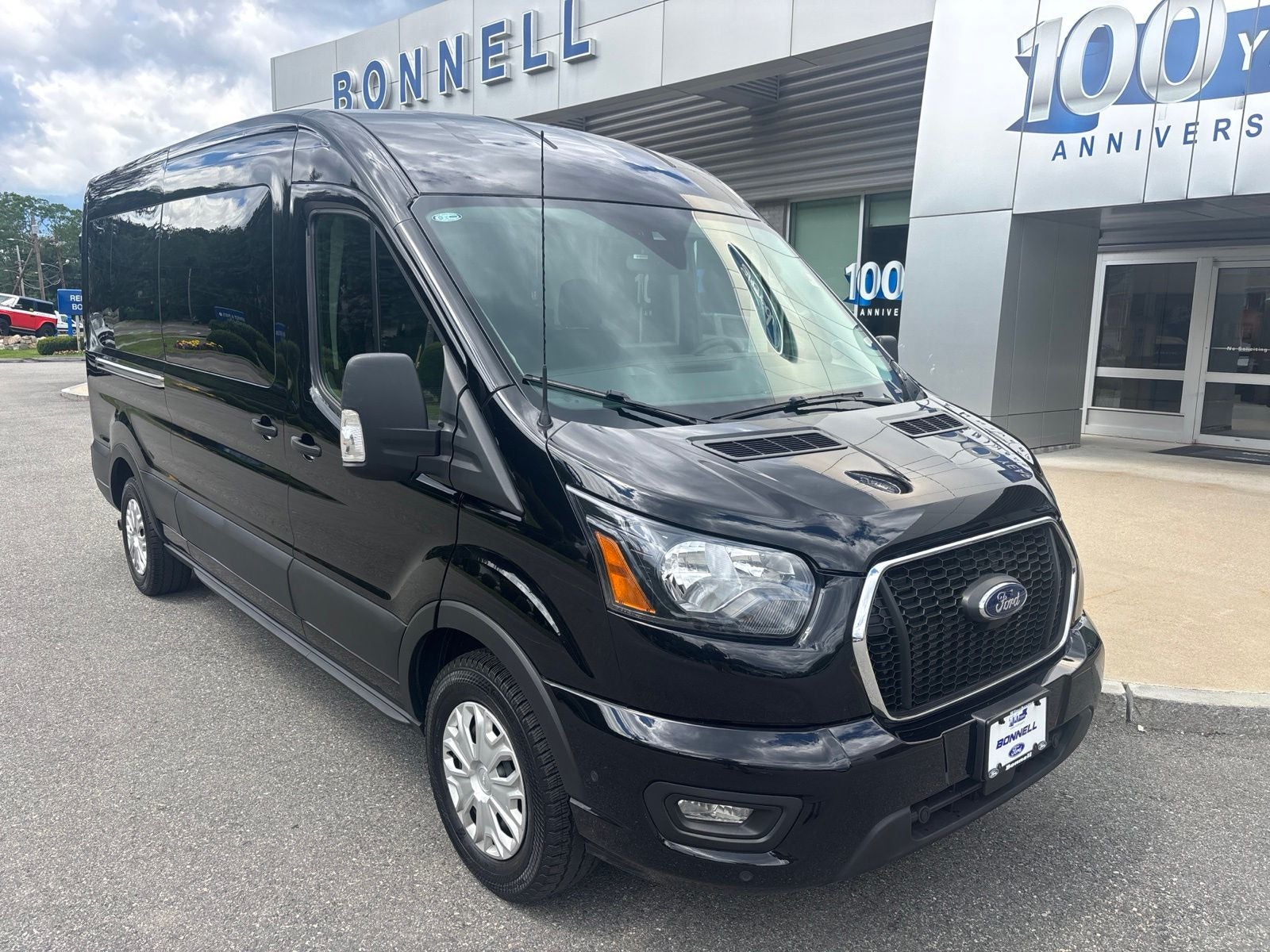 2025 Ford Transit-350 XLT in Agate Black Metallic — front three-quarter view