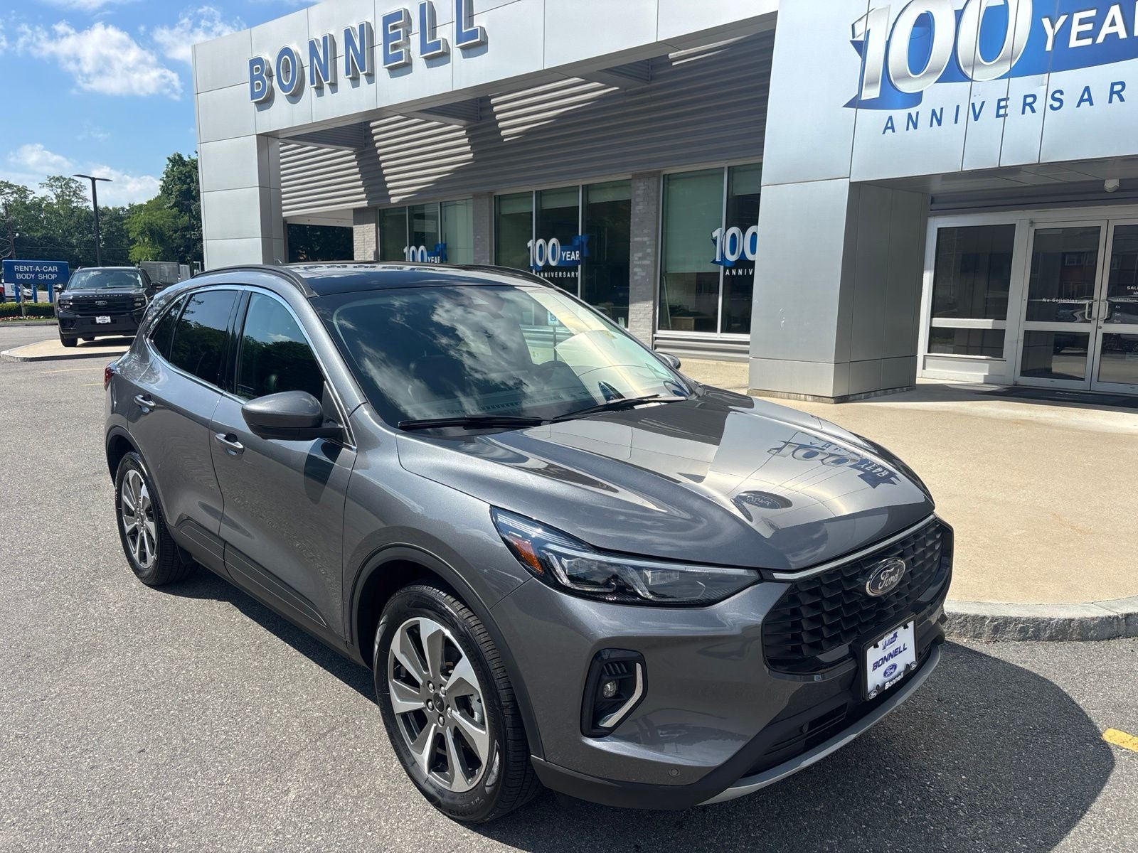 2023 Ford Escape Hybrid Platinum in Carbonized Gray Metallic — front three-quarter view