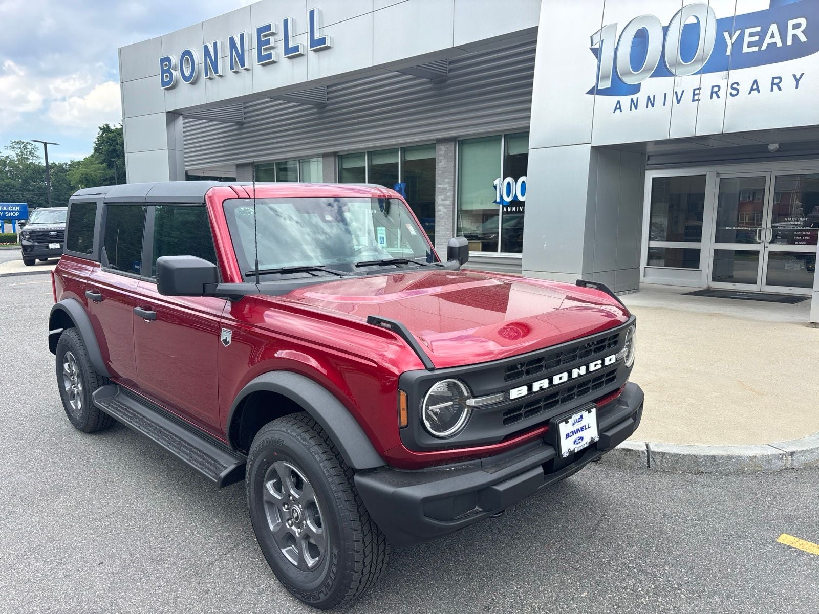 2026 Ford Bronco Big Bend in Ruby Red Metallic Tinted Clearcoat — front three-quarter view