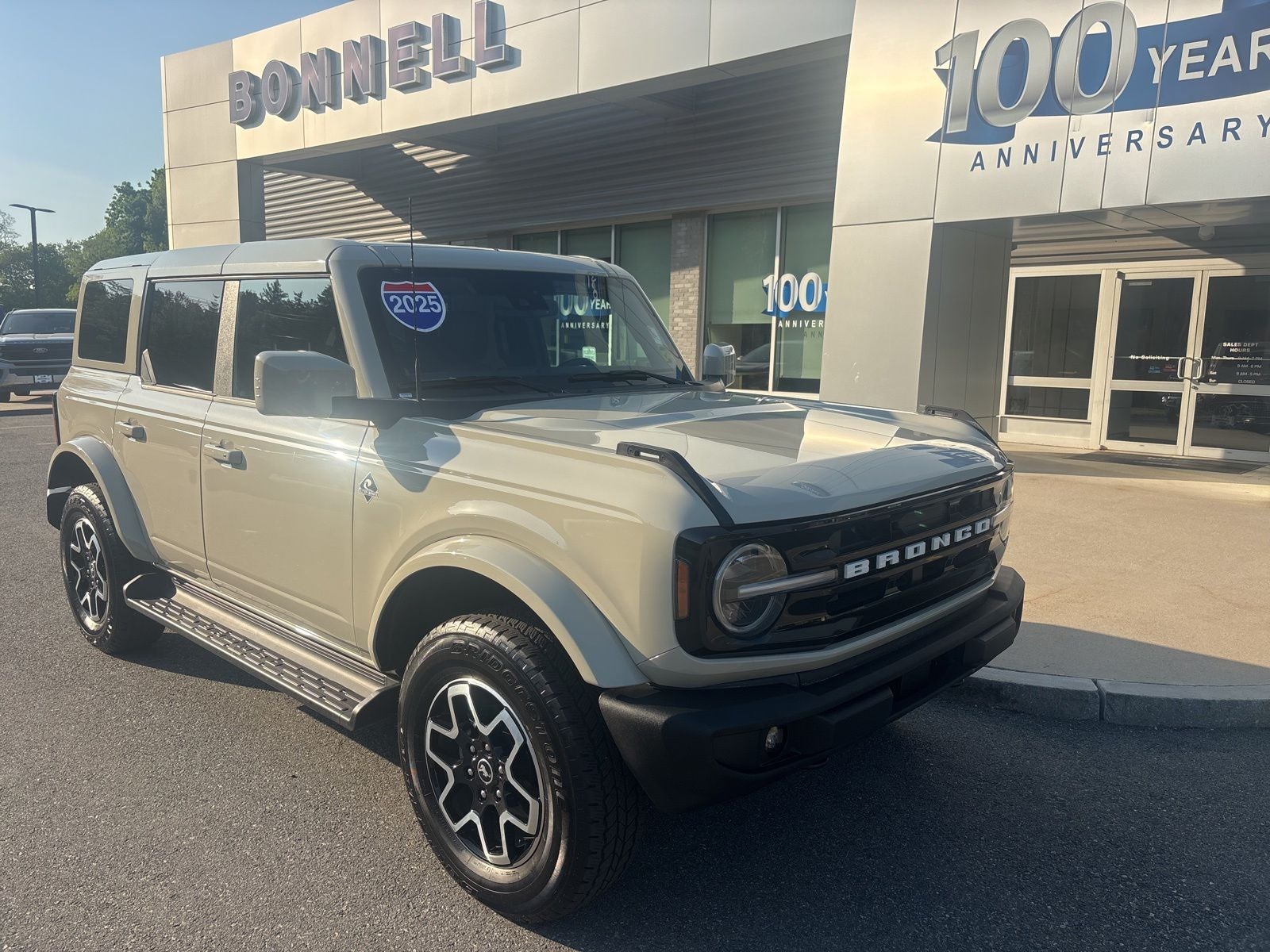 2025 Ford Bronco Outer Banks in Desert Sand — front three-quarter view