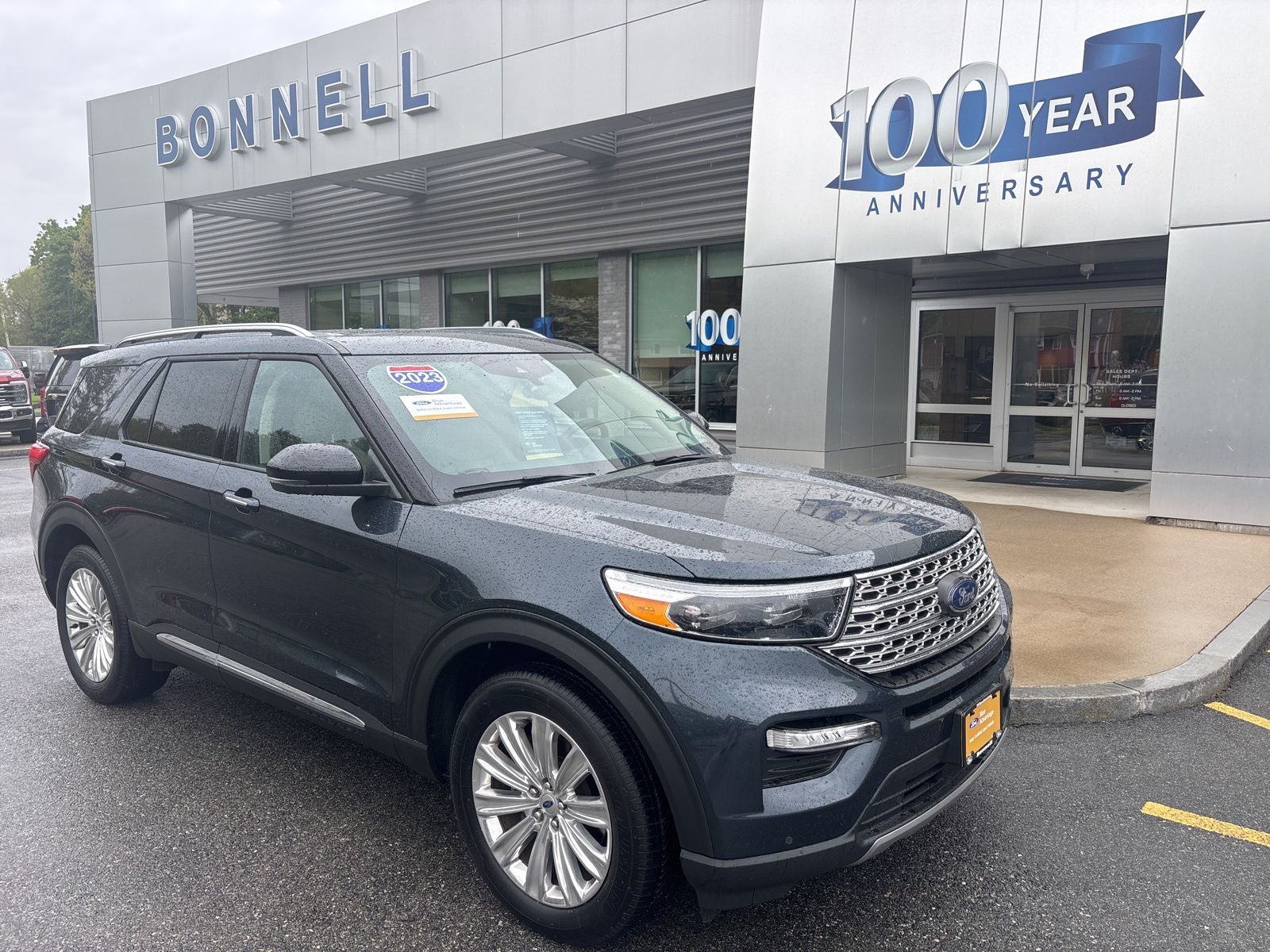 2023 Ford Explorer Limited in Stone Blue Metallic — front three-quarter view