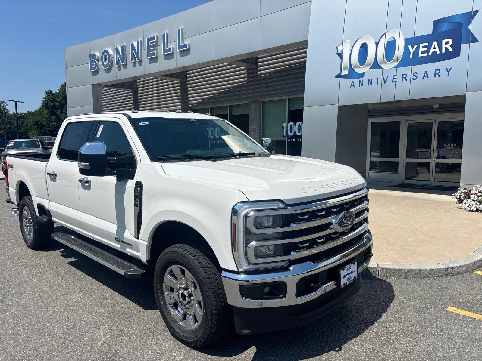 2026 Ford F-250SD Lariat in Star White Metallic Tri-Coat — front three-quarter view
