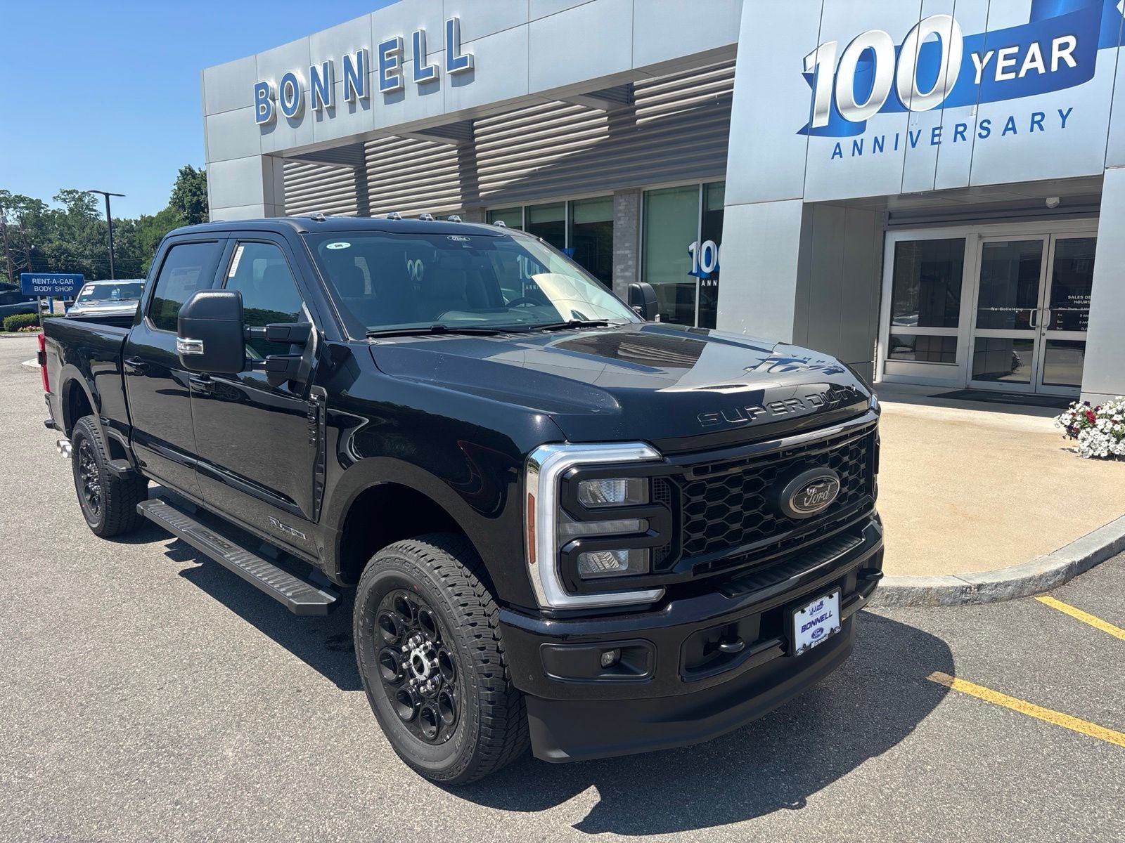 2026 Ford F-250SD XLT in Agate Black Metallic — front three-quarter view