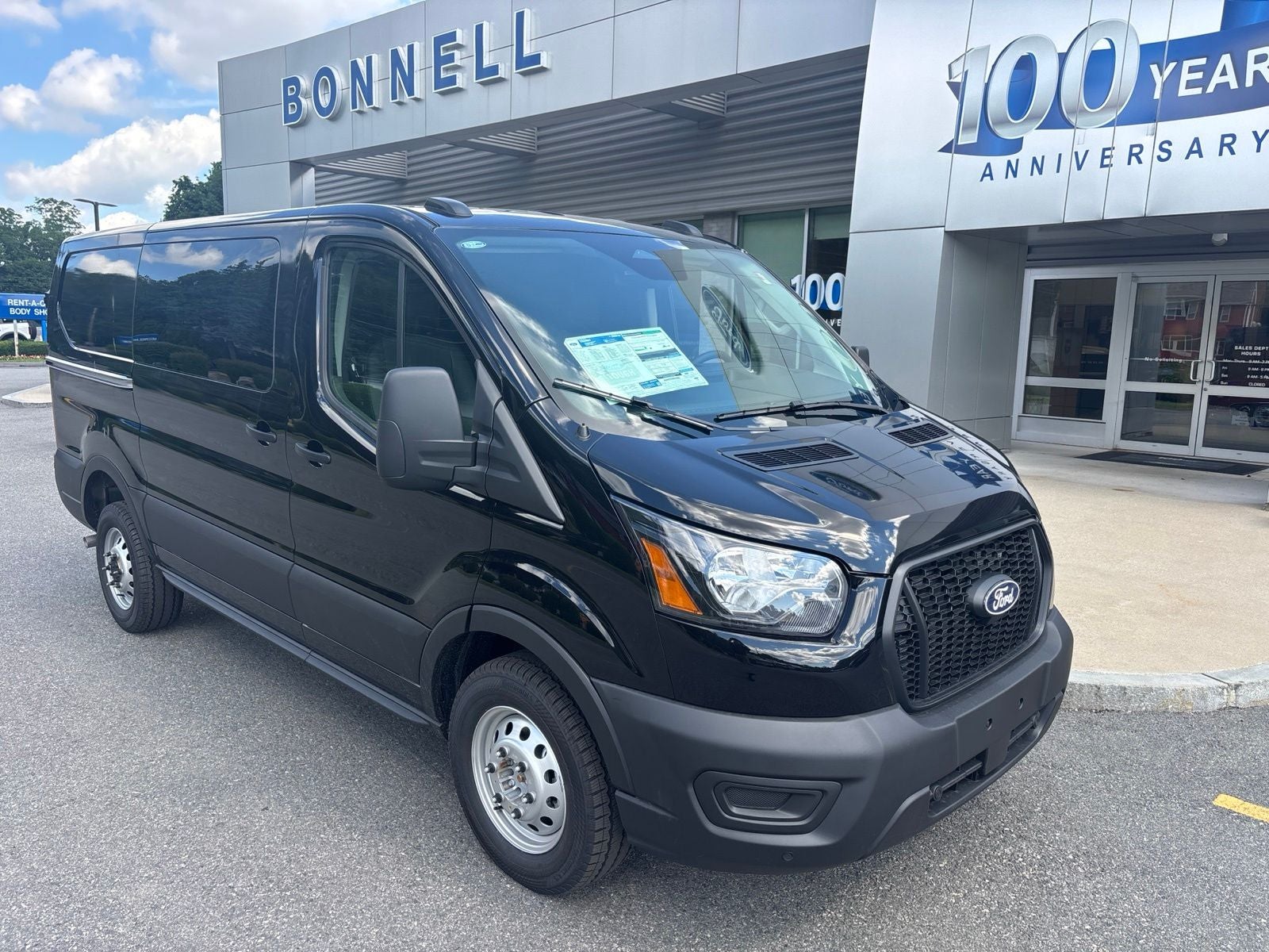 2026 Ford Transit-250 Base in Agate Black Metallic — front three-quarter view