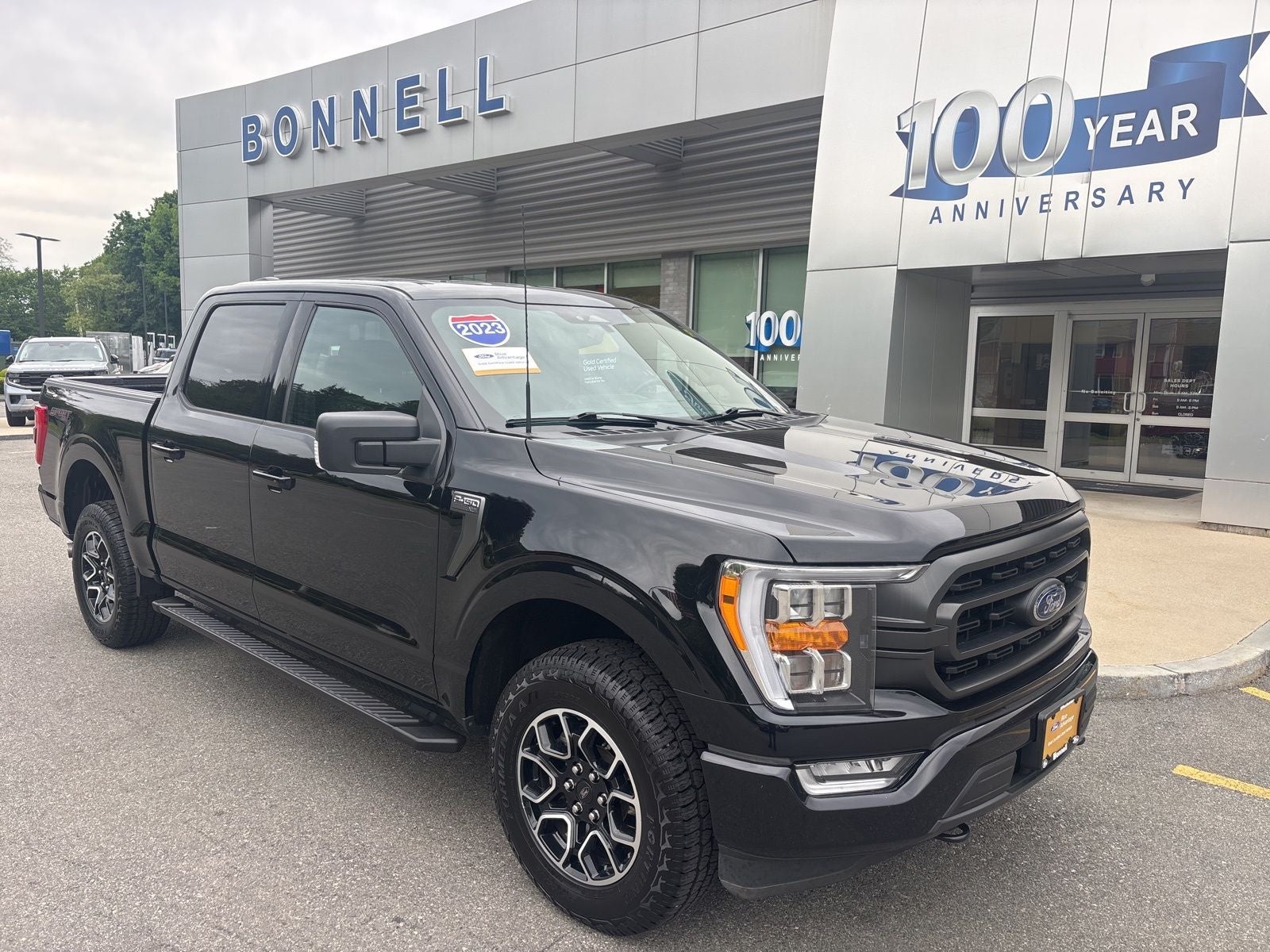 2023 Ford F-150 XLT in Agate Black Metallic — front three-quarter view