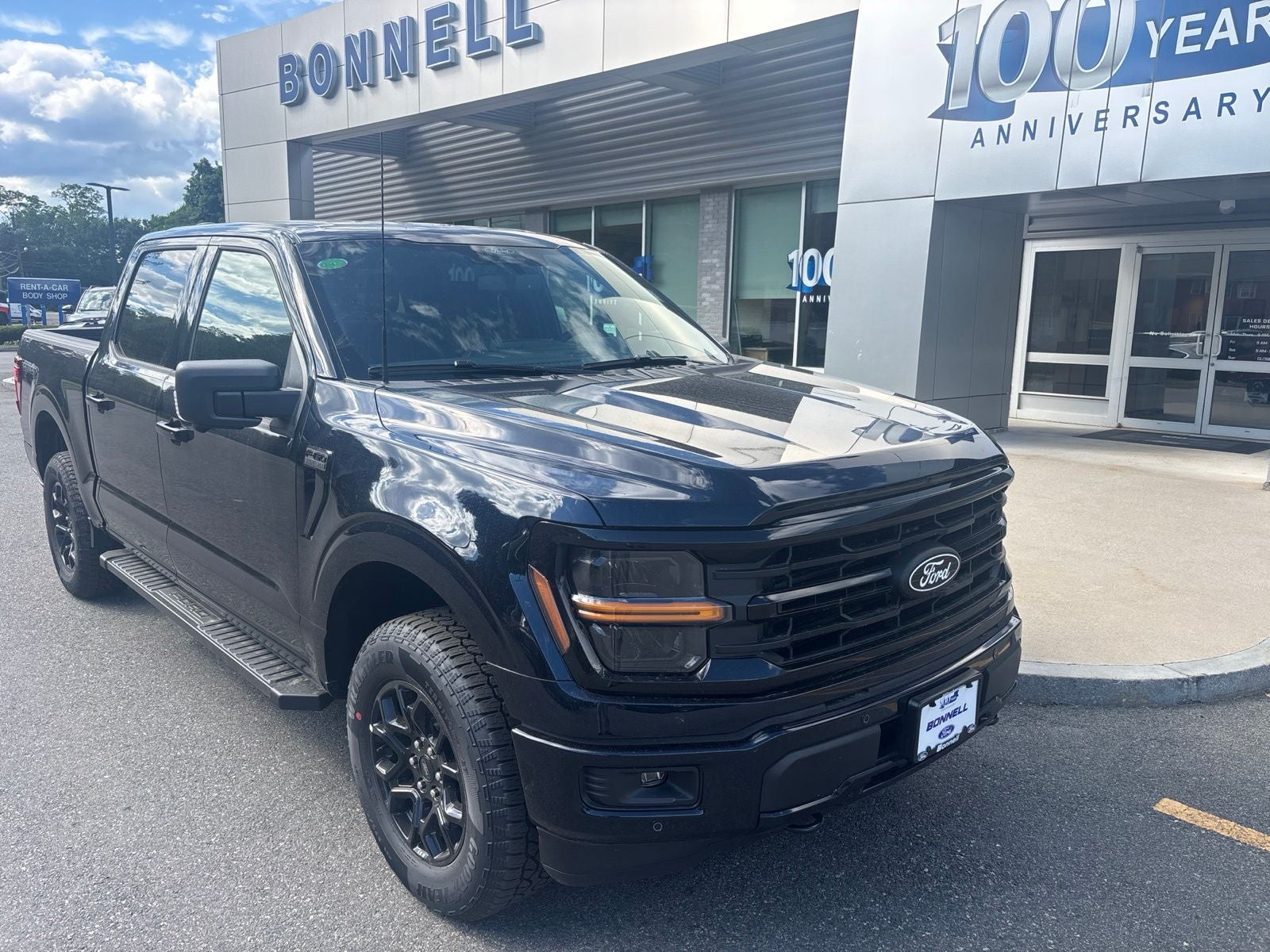 2026 Ford F-150 XLT in Antimatter Blue Metallic — front three-quarter view