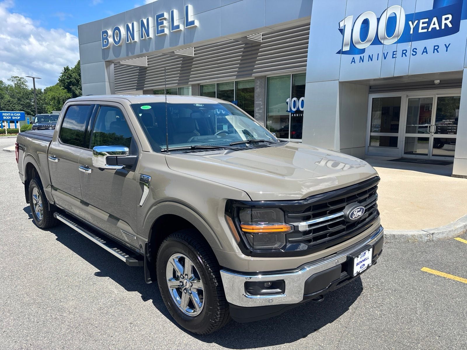 2025 Ford F-150 XLT in Marsh Gray — front three-quarter view