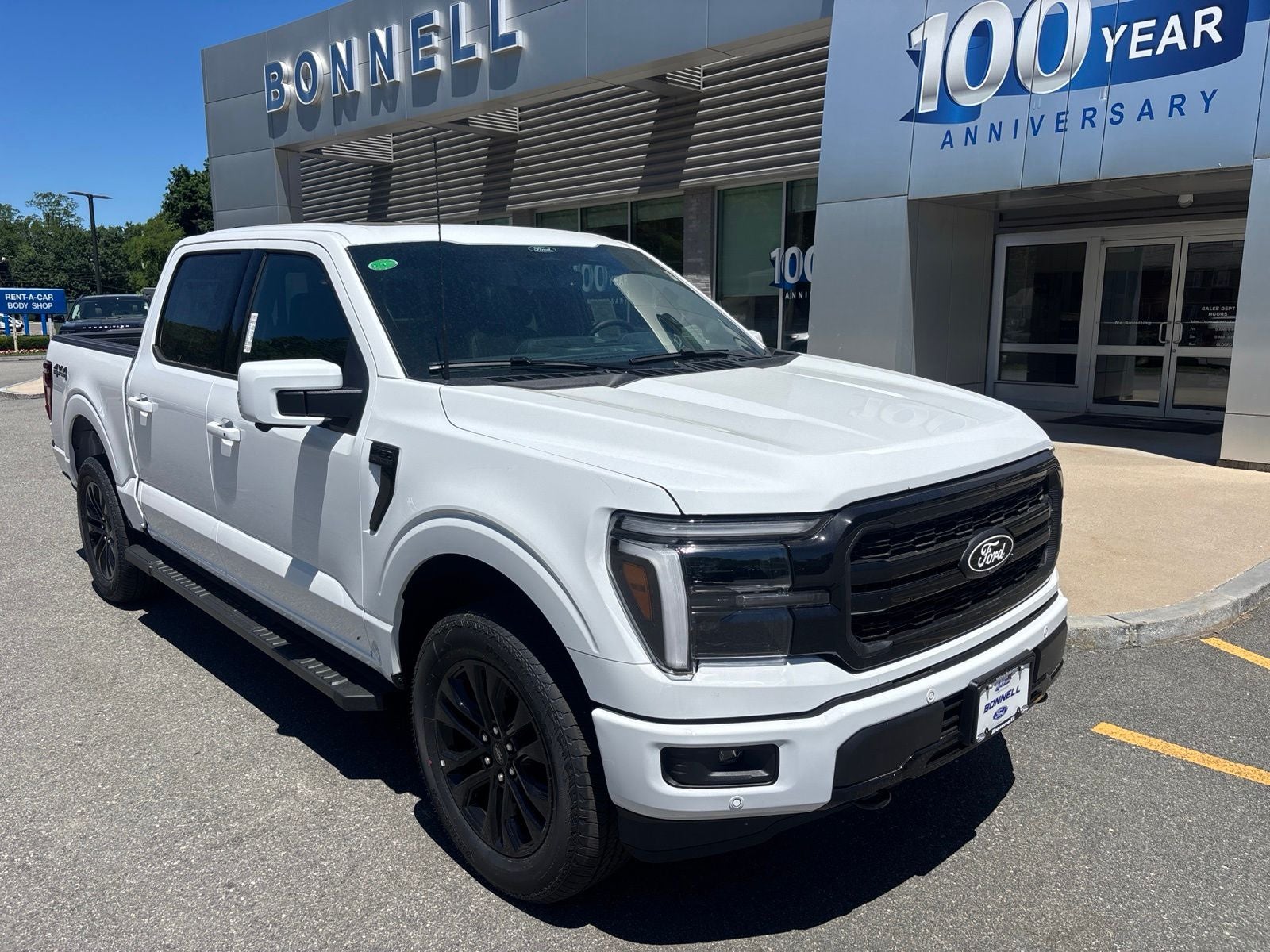 2026 Ford F-150 Lariat in Oxford White — front three-quarter view