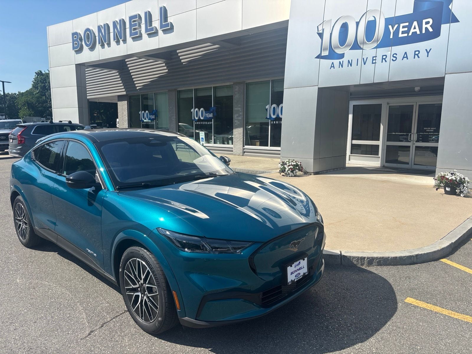 2026 Ford Mustang Mach-E Premium in Adriatic Blue Metallic — front three-quarter view