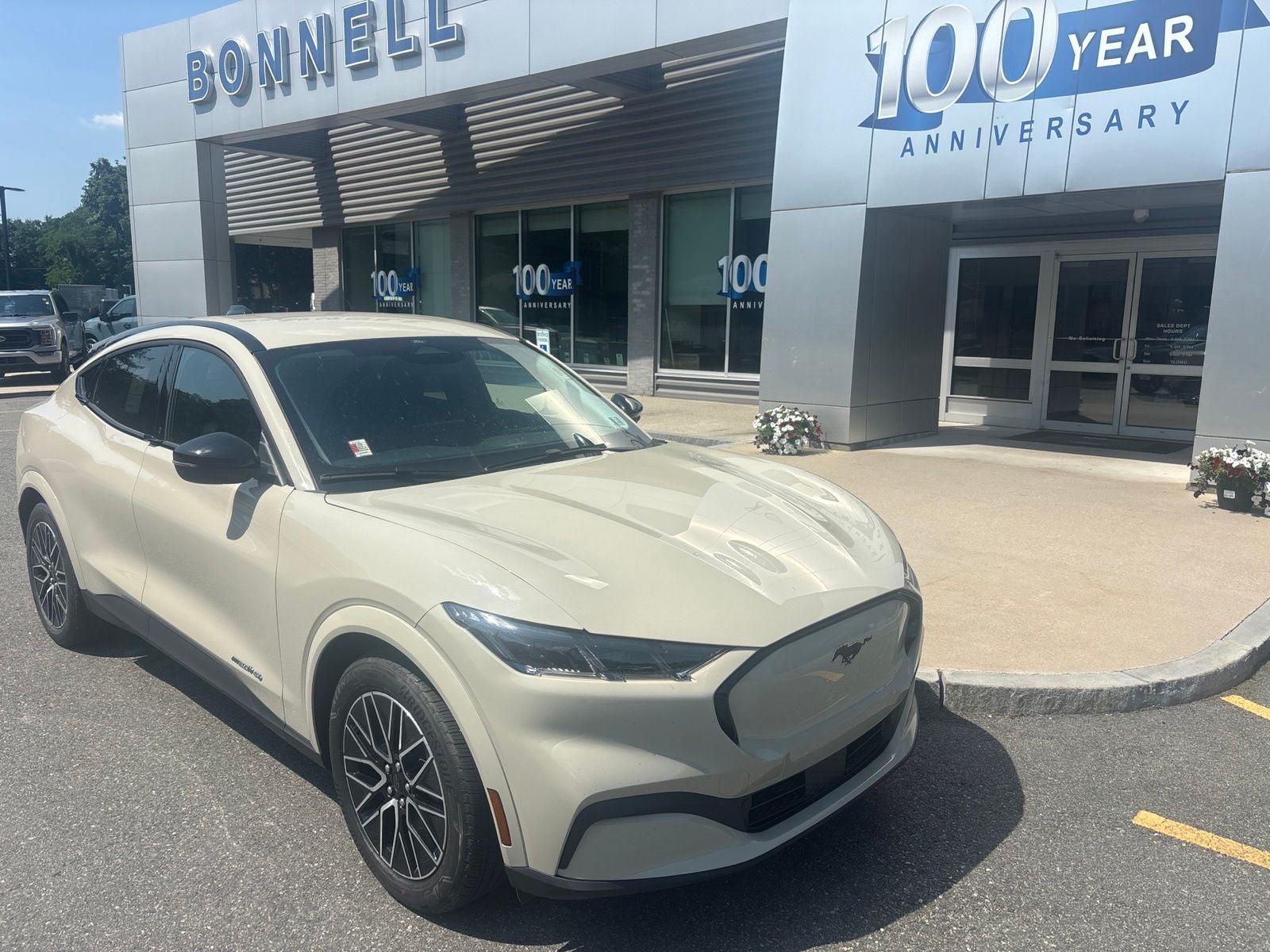 2026 Ford Mustang Mach-E Premium in Desert Sand — front three-quarter view