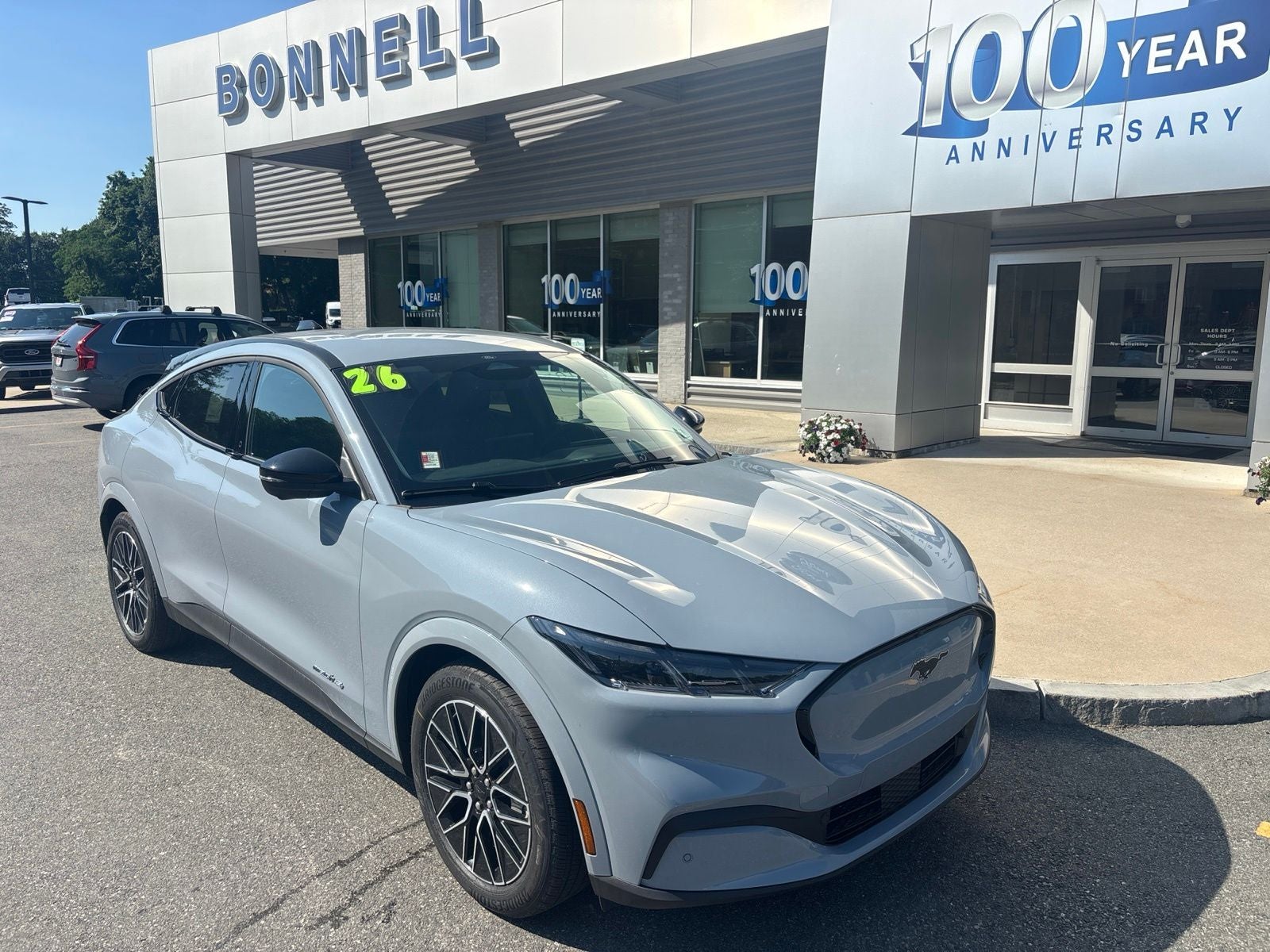 2026 Ford Mustang Mach-E Premium in Glacier Gray Metallic Tricoat — front three-quarter view