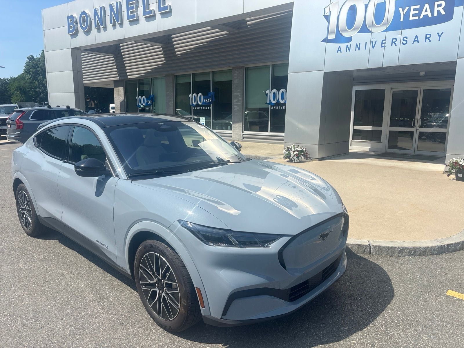 2026 Ford Mustang Mach-E Premium in Glacier Gray Metallic Tricoat — front three-quarter view
